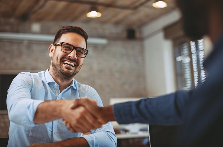 Close up of handshake in the office